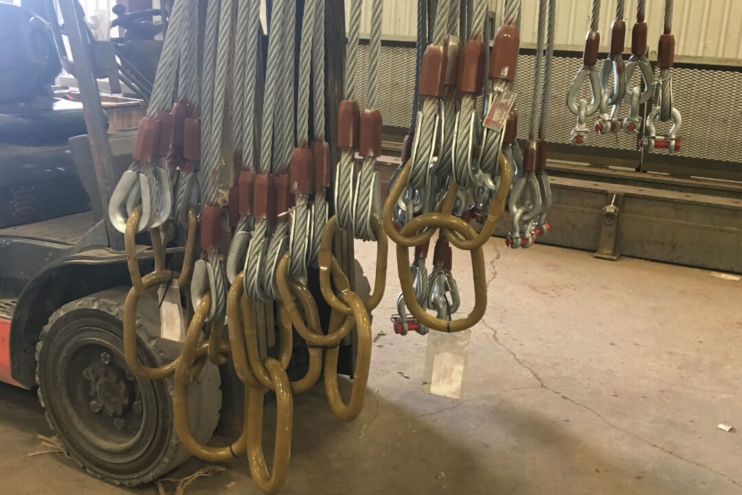 Wire rope slings hanging in the Gulf America sling shop
